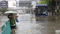 epa13264040 Residents wade through floodwater on a major street during a downpour in Bangkok, Thailand, 26 September 2026. All 50 districts in Bangkok have been declared flood disaster zones following persistent heavy rain caused by a strong low-pressure system combined with seasonal monsoon patterns.  EPA/RUNGROJ YONGRIT