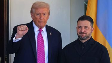 US President Donald Trump gestures as he greets Ukrainian President Volodymyr Zelensky as he arrives for a meeting at the White House in Washington, DC, on October 17, 2025. 
TOM BRENNER / AFP