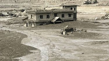 A house lies partially submerged in muddy water after flash floods at Trishuli Bazar in Nepal's Nuwakot district on August 26, 2026. A massive flood swept through Nepal's northern Rasuwa district on August 26, damaging roads and power infrastructure as authorities scrambled to assess the scale of the destruction.
Prakash MATHEMA / AFP