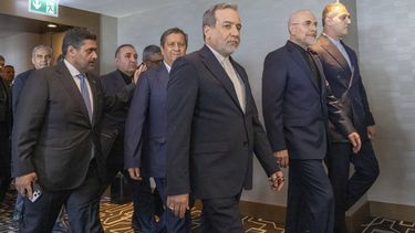 Iran's delegation including Minister of Foreign Affairs of Iran Abbas Araghchi (C) and Speaker of the Islamic Parliament of Iran, Mohammed Bagher Ghalibaf (2ndR) arrive for a quadrilateral meeting between the United States, Iran, Pakistan and Qatar at the Burgenstock luxury hotel complex near Lake Lucerne, Switzerland, on June 21, 2026, as part of talks aimed at advancing a deal to end the Middle East conflict. A new round of negotiations over the Middle East war was set to kick off on June 21, 2026 with Iranian negotiators arriving in the Swiss host city hours ahead of US Vice President JD Vance, even as Tehran said it was closing the Strait of Hormuz again over Israeli attacks in Lebanon. 
URS FLUEELER / POOL / AFP