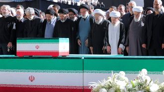 epa13088532 A handout picture made available by the Iranian supreme leader's office shows, Iranian officials and Ayatollah Ali Khamenei’s sons pray over his coffin and of his family members at a mass prayer for late Iranian supreme leader Ayatollah Ali Khamenei during a farewell ceremony ahead of his funeral at the grand Mosallah mosque in Tehran, Iran, 05 July 2026. Iran is holding a multi-day state funeral from 04 to 09 July 2026 for the Iranian supreme leader assassinated on 28 February.  EPA/IRANIAN SUPREME LEADER OFFICE HANDOUT RESTRICTIONS: ISRAEL OUT - NO ACCESS ISRAEL MEDIA/PERSIAN LANGUAGE TV STATIONS OUTSIDE IRAN/STRICTLY NO ACCESS BBC PERSIAN/VOA PERSIAN/MANOTO TV/IRAN INTERNATIONAL TVHANDOUT EDITORIAL USE ONLY/NO SALES