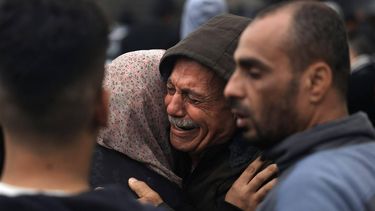 Palestinians mourn their relatives, killed in an overnight Israeli strike on the Al-Maghazi refugee camp, during a mass funeral at the Al-Aqsa hospital in Deir Al-Balah, in the southern Gaza Strip, on December 25, 2023, amid ongoing battles between Israel and the Palestinian militant group Hamas. 
MAHMUD HAMS / AFP