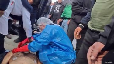 This video grab taken on January 14, 2026 from UGC images posted on social media on January 13, 2026, shows a pathologist examining a body at the Tehran Province Forensic Diagnostic and Laboratory Centre in Kahrizak, as grieving relatives search for their loved ones. Other videos showing the same scenes first appeared online on January 10, 2026.
A violent crackdown on a wave of protests in Iran has killed at least 648 people, a rights group said on January 12, 2026, as Iranian authorities sought to regain control of the streets with mass nationwide rallies.
UGC / AFP