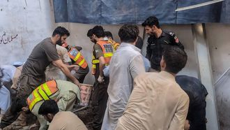 This photograph taken and released by the Khyber Pakhtunkhwa province's Emergency Service (Rescue 1122) on October 15, 2026 shows rescue workers during a search operation after a roof collapsed at a school in Peshawar. Sixteen pupils and a teacher were killed on October 15 after a roof collapsed at a school in the northwest Pakistani city of Peshawar, emergency services said.
Handout / Khyber Pakhtunkhwa province's Emergency Service (Rescue 1122) / AFP