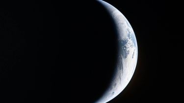 This handout picture by an Artemis II crew member provided by NASA shows a sliver of Earth illuminated against the blackness of space through the window of the Orion spacecraft on April 4, 2026.
 The four astronauts on NASA's Artemis 2 mission began their fifth day journeying to the Moon on March 5, after already taking in sights of the lunar surface never before seen by human eyes.

Handout / NASA / AFP