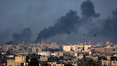 Smoke billows over buildings in Rafah in the southern Gaza Strip during Israeli bombardment on January 25, 2024, amid ongoing battles between Israel and the Palestinian militant group Hamas. 
AFP