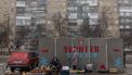 People sell vegetables and other goods next to a bomb shelter at a market in Kramatorsk, Donetsk region, on January 19, 2024, amid the Russian invasion of Ukraine.  
Roman PILIPEY / AFP