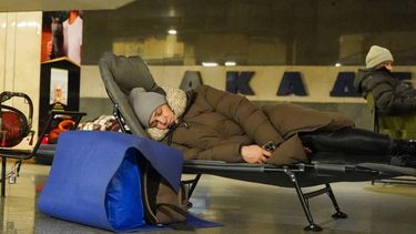 People take shelter at a metro station during Russian air attacks in Kyiv on December 27, 2025, amid the Russian invasion of Ukraine. Several powerful explosions rocked Kyiv on Saturday as authorities warned that the Ukrainian capital was under threat of missile attack.
