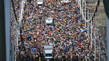 Participants march on the Elisabeth bridge as they take part in the Budapest Pride Parade in Budapest, Hungary on June 27, 2026. 
Attila KISBENEDEK / AFP