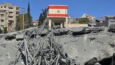 A flag of Lebanon painted on an overhead water tank is pictured at the site of an Israeli airstrike in the southern Lebanese city of Nabatieh on March 5, 2026. Israel launched on March 5 a fresh wave of strikes on Iran, which stepped up its attacks on Gulf nations Qatar and Bahrain, as the Middle East war spread throughout the region and beyond.
Mouhammad al-ZANATY / AFP