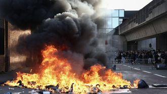Smoke rises from burning trash bins, as part of ongoing student blockading action calling for the hiring of substitute teachers, increased resources, and decent learning conditions in Lille, northern France, on October 1, 2026. Since late September, students have staged protests outside schools over grievances ranging from timetables, class sizes and a shortage of teachers to overheated classrooms during this year's heatwaves. The protests started in the Ile-de-France region around Paris but have now spread to other cities nationwide. 

Sameer AL-DOUMY / AFP