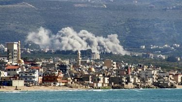 This photograph taken from the southern Lebanese area of Tyre shows smoke as it rises from the site of an Israeli airstrike that targeted the village of Qlaileh on April 13, 2026. Lebanon was pulled into the Middle East war when Hezbollah fired rockets at Israel after US-Israeli strikes killed Iran's supreme leader on February 28. Israel responded with massive strikes and a ground invasion.
Kawnat HAJU / AFP