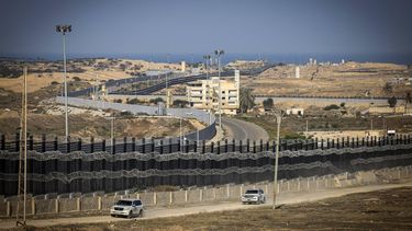 UN cars drive down a road along the Egyptian border, west of Rafah in the southern Gaza Strip on January 14, 2024, as the ongoing war between Israel and the Palestinian Hamas group enters its 100th day. 
AFP