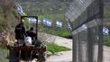 Palestinian farmers from the village of Burqa, drive their tractor past a fence decorated with Israeli flags installed by Jewish settlers after they announced their control over the historical Al-Masoudiya Ottoman era train station, which operated between the Palestinian cities of Nablus and Tulkarm in the 1920s, just north of the city of Nablus, in the northern Israeli-occupied West Bank on February 15, 2026. Violence in the Palestinian West Bank, which Israel has occupied since 1967, has soared since the Hamas attack on Israel triggered the Gaza war in October 2023. New Israeli measures taken on the weekend of February 9, 2026, for the occupied West Bank, are expected to accelerate the territory's annexation, ease land purchases by settlers and push Palestinians into increasingly isolated enclaves.
Jaafar ASHTIYEH / AFP