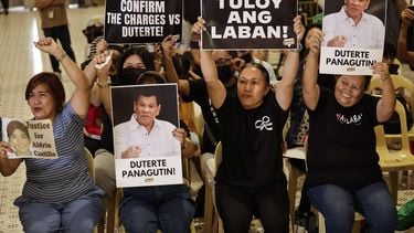 epa12906785 Relatives of victims of extrajudicial killings during the drug war campaign of former Philippine president Rodrigo Duterte react after watching a broadcast of the International Criminal Court (ICC) during a gathering at a university in Quezon City, Metro Manila, Philippines, 22 April 2026. The ICC at The Hague on 22 April denied the appeal of Duterte challenging the judicial body's jurisdiction over the charges filed against the former leader. Duterte faces charges of crimes against humanity resulting from his anti-illegal drugs campaign.  EPA/ROLEX DELA PENA