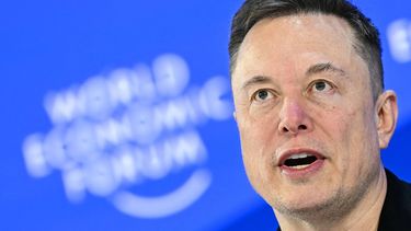 (FILES) CEO of SpaceX and Tesla, South African-Canadian-US businessman Elon Musk speaks during the World Economic Forum (WEF) annual meeting in Davos on January 22, 2026. SpaceX's filing with US regulators was revealed on May 20, 2026, laying out plans for what could become the largest initial public offering in history as Elon Musk's rocket and satellite company seeks to raise up to $75 billion on the public markets. The filing with the Securities and Exchange Commission -- the first time SpaceX has publicly disclosed detailed financial information  -- revealed that the company generated $18.7 billion in revenue in 2025 and posted an operating loss of $2.6 billion as it poured money into next-generation rocket development and AI.

Fabrice COFFRINI / AFP