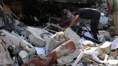 Workers remove the rubble from a site targeted overnight by an Israeli airstrike in the southern Lebanese village of Et Taybeh, on November 7, 2025. Israel said it struck a series of Hezbollah targets in southern Lebanon on November 6, 2025, with Lebanon's President Joseph Aoun denouncing the new attacks as a 