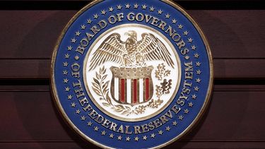 The seal of the Federal Reserve Board of Governors is seen during a press conference by Federal Reserve Chairman Ben Bernanke on June 19, 2013 at the Federal Reserve Board Building in Washington, DC. Bernanke held the press conference after the Federal Opening Market Committee meeting. AFP PHOTO/Mandel NGAN 
Mandel NGAN / AFP