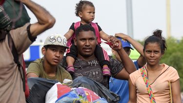 Vluchtelingen steken de grens bij Colombia over. Foto: ANP