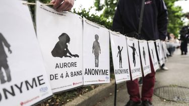 epa12140694 People, including victims, carry banners representing the victims of Joel Le Scouarnec on the verdict day of the trial of the French surgeon in Vannes, France, 28 May 2025. A French court on 28 May handed retired surgeon Joel Le Scouarnec a 20-year sentence for the rape and aggravated sexual assault of 299 victims, most of them minors, crimes committed between 1986 and 2014.  EPA/TERESA SUAREZ