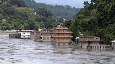 epa13200024 Submerged houses are seen following flash floods along the banks of the Trishuli River in Dhading district, Nepal, 30 August 2026. More than 700 people were killed, and hundreds remain missing across northern Nepal after a glacial collapse and avalanche triggered flash floods and mudslides along the Bhotekoshi and Trishuli river valleys near the Nepal-Tibet border, causing widespread destruction to settlements and infrastructure, according to the National Disaster Risk Reduction and Management Authority (NDRRMA).  EPA/NARENDRA SHRSTHA