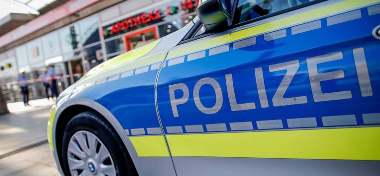 epa07096943 A police car is parked in front of a pharmacy at the Central Station in Cologne, Germany, 16 October 2018. Police are investigating a terrorist background after a hostage-taking at Cologne's Main Station on 15 October 2018, in which the hostage-taker was shot down by special forces and seriously injured.  EPA/SASCHA STEINBACH