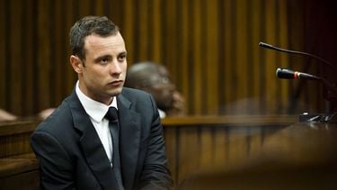 South African paralympic athlete Oscar Pistorius looks on on the fifth day of his trial for the 2013 murder of his girlfriend, on March 7, 2014 at the high court in Pretoria. Pistorius, a double amputee known as the 