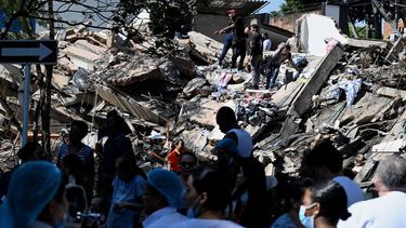 People work on a collapsed building after an earthquake in Cali, Colombia on August 10, 2026.  A powerful earthquake rocked Colombia and neighboring Latin American countries on August 10, 2026, with medical teams rushing to help victims after buildings were damaged or collapsed in several cities. The Colombian geological service and its American counterpart USGS put the magnitude at 7.4, with an epicenter 100 km (60 miles) underground in the west of the country. Colombia had initially put it at 6.6.
Joaquin SARMIENTO / AFP