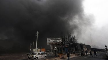 epa12803566 A view of the Main gate to the Shahran Oil Refinery as smoke still rises following last night airstrike in Tehran, Iran, 08 March 2026. A joint Israeli and US military operation continues to target multiple locations across Iran since the early hours of 28 February 2026.  EPA/ABEDIN TAHERKENAREH