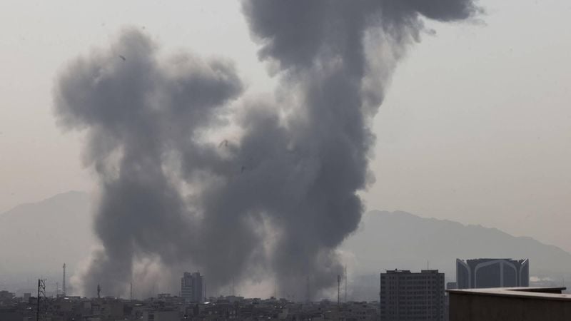 A plume of smoke rises following a reported explosion in Tehran on February 28, 2026. Two loud blasts were heard in Tehran on February 28 morning by AFP journalists, and two plumes of thick smoke were seen over the centre and east of the Iranian capital. Israel's defence ministry announced it had launched a 