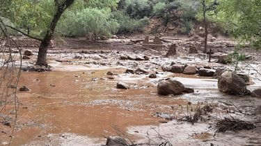 This handout image released by the Grand Canyon National Park Service via X  (formerly Twitter) on August 30, 2026 shows remnants of stone bridge pylons along Bright Angel Creek following a flash flood that destroyed the footbridge on August 29.  More than 20 people may be missing after the flash flood in Grand Canyon National Park according to the National Park Service. The floods hit the Bright Angel Canyon and Phantom Ranch area on Saturday, the service said, adding that it was working with Arizona authorities to evacuate people and account for individuals in the affected area.

Handout, J.THOMPSON / NATIONAL PARK SERVICE / AFP
