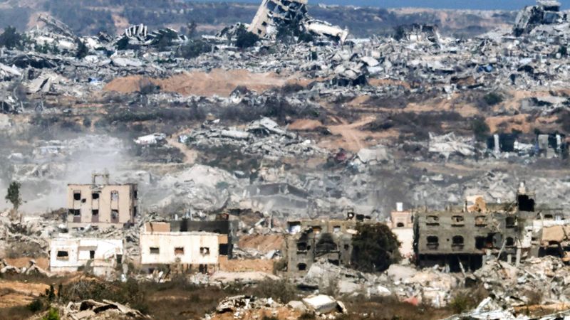Destroyed buildings are pictured in the Gaza Strip as seen from a position along the border in southern Israel on July 29, 2025. 
Jack GUEZ / AFP