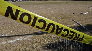 A 'caution' tape surrounds the football field where at least 11 people were killed and 12 more wounded during an attack on the eve in Salamanca, Guanajuato state, Mexico, on January 26, 2026. Guanajuato state is a thriving industrial hub and home to several popular tourist destinations, but also remains the country's deadliest state due to gang turf wars, according to official homicide statistics.
Mario Armas / AFP