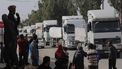 2023-11-25 10:06:21 epa10994986 Trucks carrying humanitarian aid wait to cross from the southern Gaza Strip into the northern Gaza Strip along Salah Al Din road in the central Gaza Strip, 25 November 2023. After Israel and Hamas agreed to a four-day ceasefire mediated by Qatar, the USA, and Egypt, and that came into effect on 24 November, some Palestinians who were still in central Gaza moved towards the south, while others already internally displaced in the south went back to the northern part to check on relatives they had left behind and to collect salvageable belongings from their houses. As part of the ceasefire, the agreement included that 50 Israeli hostages, women and children, are to be released by Hamas. 150 Palestinian women and children that were detained in Israeli prisons are to be released in exchange. Thousands of people have died since Hamas militants launched an attack against Israel from the Gaza Strip on 07 October, and the Israeli operations in Gaza and the West Bank which followed it.  EPA/MOHAMMED SABER