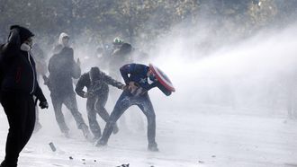 epa13311392 French police use a water cannon against protesters following clashes during a demonstration over the rising cost of living and cuts to public services in Paris, France, 17 October 2026. The nationwide mobilization brings together Yellow Vest (Gilets Jaunes) activists, high school and university students, trade unions and other groups protesting rising living costs, fuel prices and deteriorating public services, while demanding improvements in education and school conditions.  EPA/YOAN VALAT