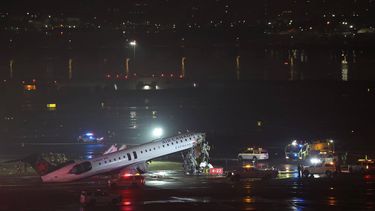 An Air Canada Express CRJ-900 sits on the runway after colliding with a Port Authority fire truck at LaGuardia Airport in New York, on March 23, 2026. Air Canada Express flight AC8646 originated from Montreal and collided with the fire truck during landing.
ANGELA WEISS / AFP