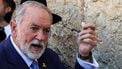 The US' new ambassador to Israel Mike Huckabee holds a note given to him from US President Donald Trump to be placed in the cracks of the Western Wall, the holiest site where Jews are allowed to pray, during Huckabee's visit to the holy site in the old city of Jerusalem on April 18, 2025. 
GIL COHEN-MAGEN / AFP