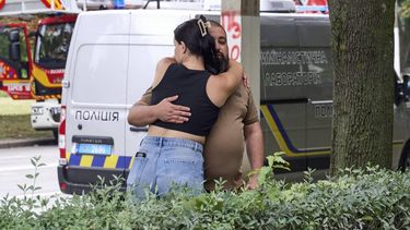 epa13157887 People react at the site of a Russian strike on a high-rise residential building in Kharkiv, Ukraine, 09 August 2026, amid the Russian invasion. At least one person was killed and 27 people were injured, including one child, after a Russian attack in Kharkiv, according to the State Emergency Service.  EPA/SERGEY KOZLOV