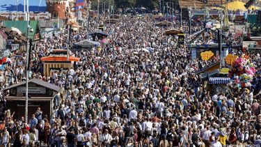 Visitors walk at the Theresienwiese fairground during the 190th Oktoberfest beer festival in Munich, southern Germany on September 21, 2025. The world's biggest beer festival Oktoberfest runs until October 5, 2025. 
Michaela STACHE / AFP