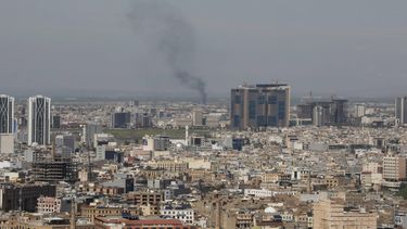A plume of smoke rises following an interception of a drone in Erbil on March 12, 2026. Air strikes killed at least nine Iran-backed fighters in Iraq on March 12 near the Iraqi-Syrian border, two senior security officials told AFP. The Middle East war, which was triggered on February 28 by American-Israeli attacks on Iran, is hampering the global economy's supply of oil and weakening production capacity.
Shvan HARKI / AFP