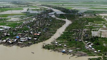 This picture taken from a helecopter on July 29, 2008, shows a general aerial view of an area affected by cyclone Nargis at Bogalay township.   Myanmar's military regime is giving desperately needed aid to cyclone survivors on credit, requiring them to pay back to the government any assistance offered, officials said.   AFP PHOTO/Hla Hla Htay
HLA HLA HTAY / AFP