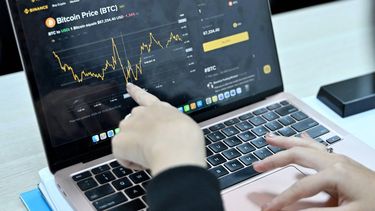 This photo taken on February 12, 2026 shows a Vietnamese cryptocurrency investor looking at the latest Bitcoin values on a laptop in Hanoi. As a first-year computer science student in Hanoi, Hoang Le started trading crypto from his university dorm room, egged on by his gamer friends who were making a killing, and at one point his digital holdings swelled to $200,000 -- around 50 times the average annual income in Vietnam. But they crashed to zero when the bottom fell out of bitcoin and other cryptocurrencies in recent months.

Nhac NGUYEN / AFP