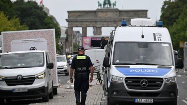 Police patrols while cleaning operations are underway on Strasse des 17. Juni street in front of Brandenburg Gate in Berlin on July 26, 2026 one day after the Christopher Street Day (CSD) parade in Berlin, that had to be stopped after a after a car ploughed into people outside the celebrations. 
 German police searched on July 26, 2026 for a suspect believed linked to Islamist circles after a car ploughed into a crowd near Berlin's Gay Pride celebrations, killing one person and wounding 16 others. The incident shattered what had been a day of celebration for hundreds of thousands attending Christopher Street Day, one of Europe's largest Pride events, and left revellers fleeing a central Berlin park as sirens echoed through the night.

RALF HIRSCHBERGER / AFP