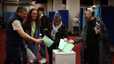 Voters cast their ballots in the Hungarian election inside the polling station set up at a hotel in west London, on April 12, 2026. The vote could end Hungarian Prime Minister Viktor Orban's 16-year stint in power as the EU's longest serving current leader and a self-decribed 