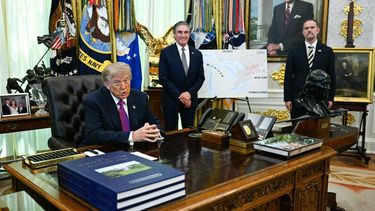 US President Donald Trump speaks alongside a map showing Lake Ontario labeled as Lake America in the Oval Office of the White House in Washington, DC, on August 27, 2026.  Also pictured are US Secretary of the Interior Doug Burgum (L) and US Trade Representative Jamieson Greer (R).
Jim WATSON / AFP