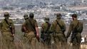 Israeli army soldiers look at destroyed buildings in the Gaza Strip as they stand on the border with the Palestinian territory, on August 13, 2025, while the war between Israel and the Palestinian Hamas militant group continues. 
Jack GUEZ / AFP