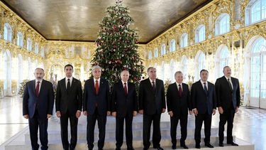 In this pool photograph distributed by Russian state agency Sputnik, (L-R) Armenia's Prime Minister Nikol Pashinyan, Turkmenistan's President Serdar Berdymukhamedov, Kazakhstan's President Kassym-Jomart Tokayev, Russia's President Vladimir Putin, Tajikistan's President Emomali Rahmon, Uzbekistan's President Shavkat Mirziyoyev, Kyrgyzstan's President Sadyr Japarov and Azerbaijan's President Ilham Aliyev pose for a photo at the Catherine Palace in the Tsarskoe Selo Museum, outside Saint Petersburg, during CIS leaders meeting on December 26, 2023. 
Alexey DANICHEV / POOL / AFP