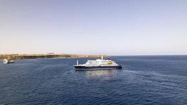 This aerial picture shows a general view of the cruise ship MV Hondius stationary off the port of Praia, the capital of Cape Verde, on May 3, 2026. An outbreak of 