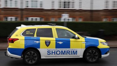 A 'Shomrim' private security car is seen driving past a synagogue in Stamford Hill, north London on October 13, 2023. The UK government announced Thursday £3 million ($3.7 million) of extra funding to help protect the Jewish community from anti-Semitic attacks, after a reported 400 percent spike in incidents since Hamas's weekend attacks in Israel.
Daniel LEAL / AFP