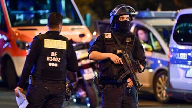 Armed police stand near the scene where one person was killed and around 16 injured after a car struck people on the outskirts of the Christopher Street Day (CSD) parade in Berlin, on July 25, 2026.
 The attack forced organisers to cut short one of Europe's largest Pride events.
